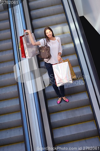 Image of happy young couple in shopping