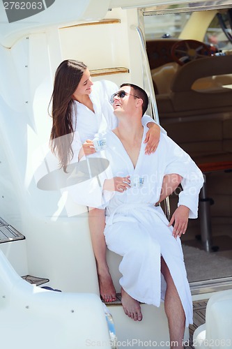 Image of young couple on yacht