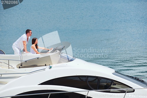 Image of young couple on yacht