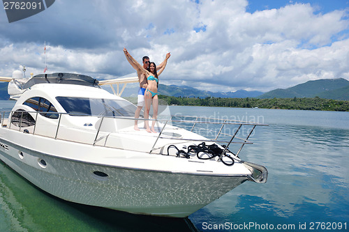 Image of young couple on yacht