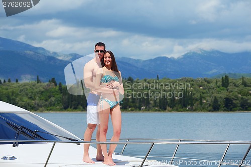 Image of young couple on yacht