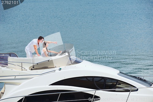 Image of young couple on yacht