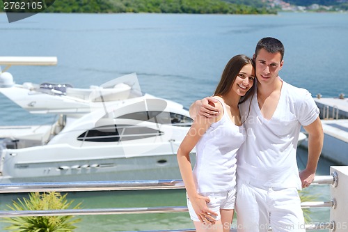 Image of young couple on yacht