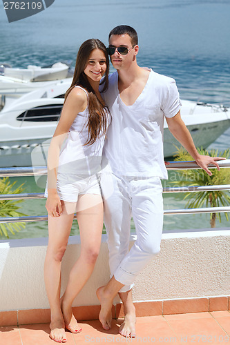 Image of young couple on yacht