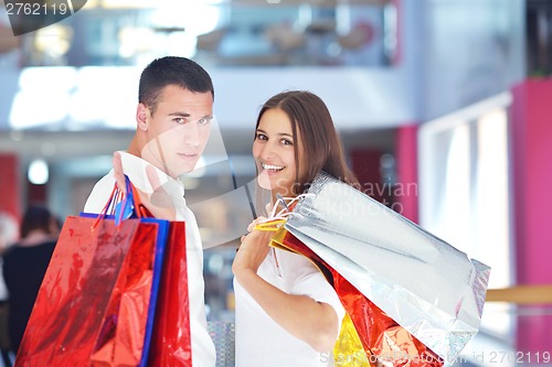 Image of happy young couple in shopping