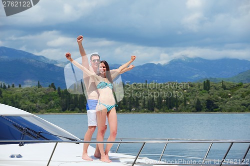 Image of young couple on yacht