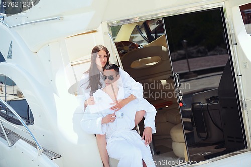 Image of young couple on yacht