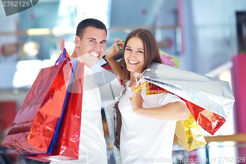 Image of happy young couple in shopping