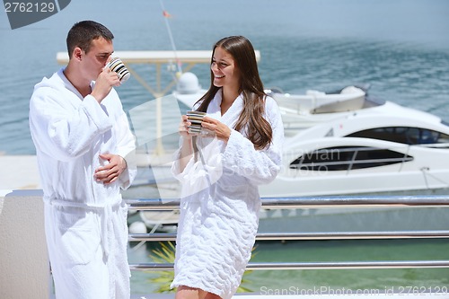 Image of young couple on yacht