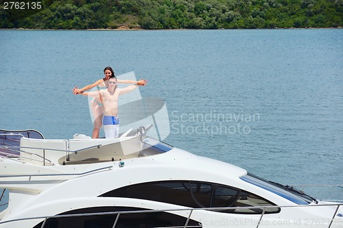 Image of young couple on yacht