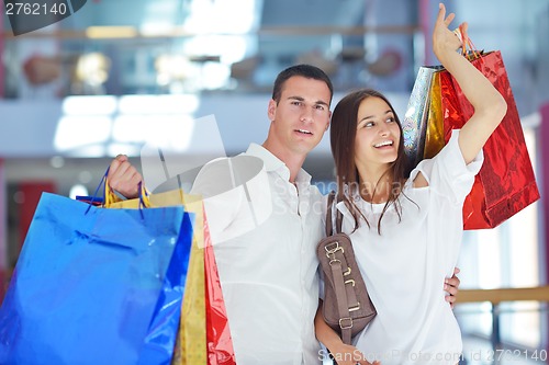 Image of happy young couple in shopping