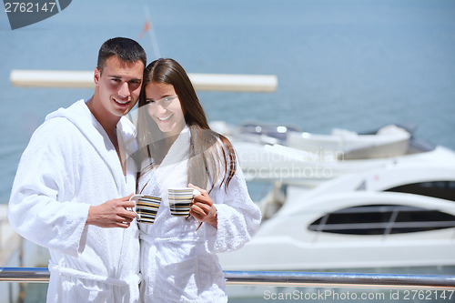 Image of young couple on yacht