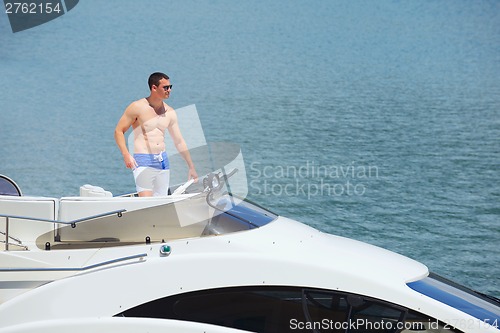 Image of young couple on yacht