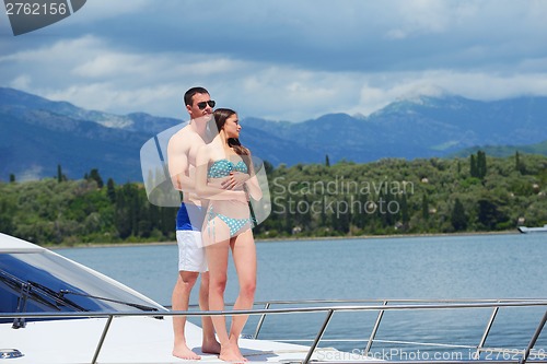 Image of young couple on yacht