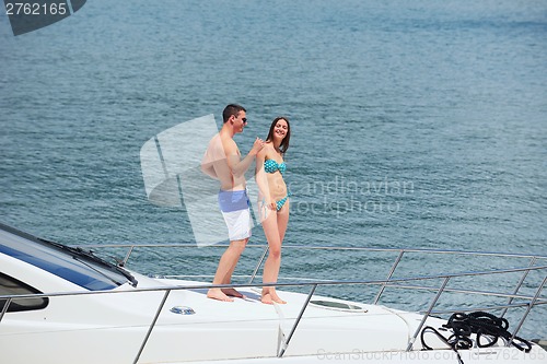 Image of young couple on yacht