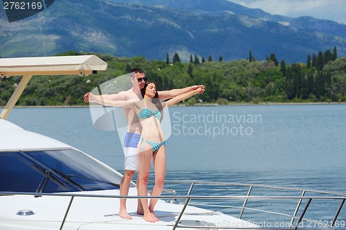 Image of young couple on yacht