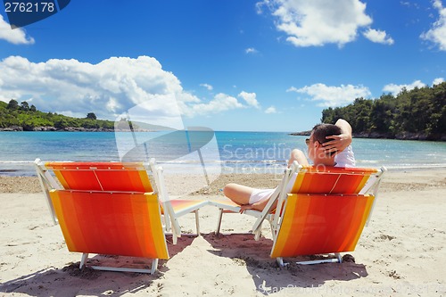 Image of happy couple have fun on the beach