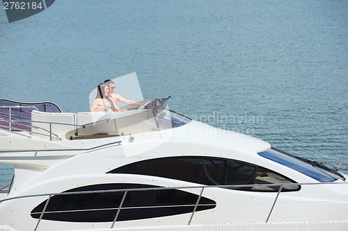 Image of young couple on yacht