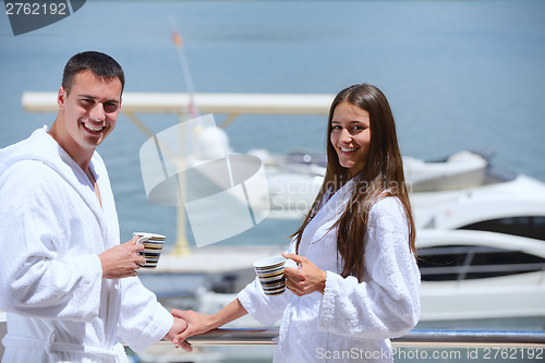 Image of young couple on yacht