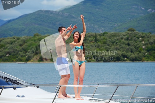 Image of young couple on yacht