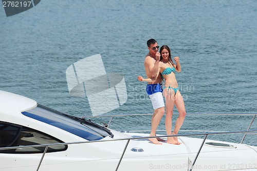 Image of young couple on yacht