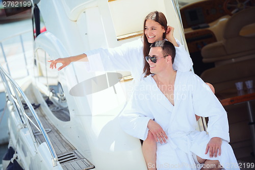 Image of young couple on yacht