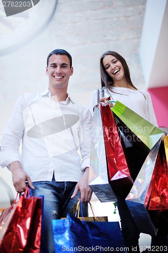 Image of happy young couple in shopping