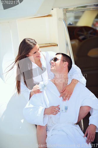 Image of young couple on yacht