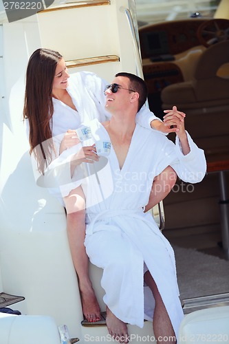 Image of young couple on yacht