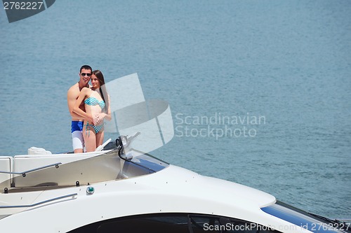 Image of young couple on yacht