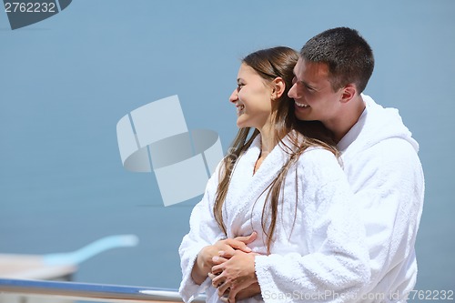 Image of young couple on yacht