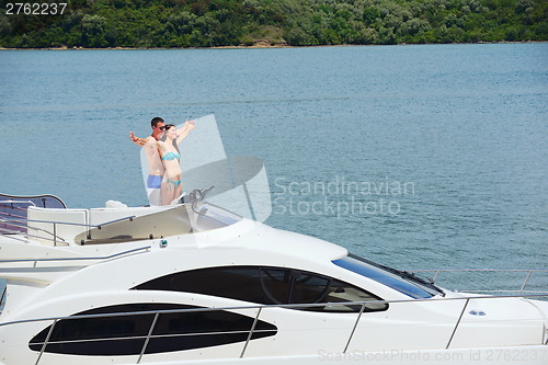 Image of young couple on yacht