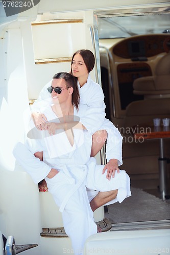 Image of young couple on yacht