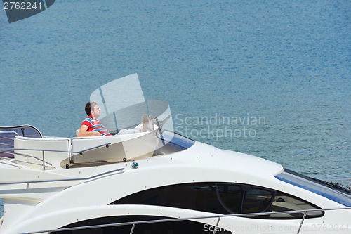 Image of young couple on yacht