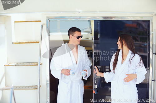 Image of young couple on yacht