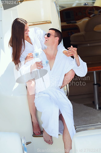 Image of young couple on yacht