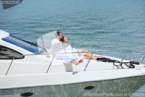 Image of young couple on yacht