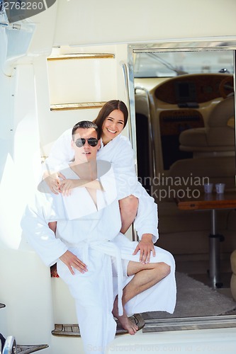 Image of young couple on yacht