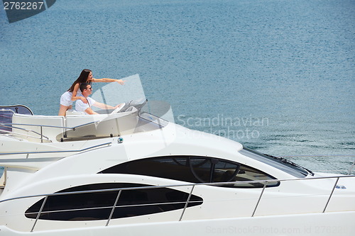 Image of young couple on yacht