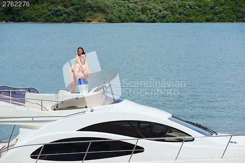 Image of young couple on yacht