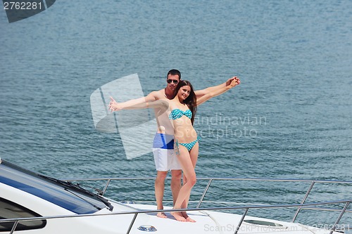 Image of young couple on yacht