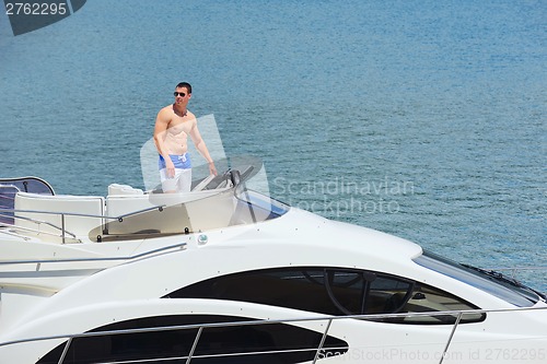 Image of young couple on yacht