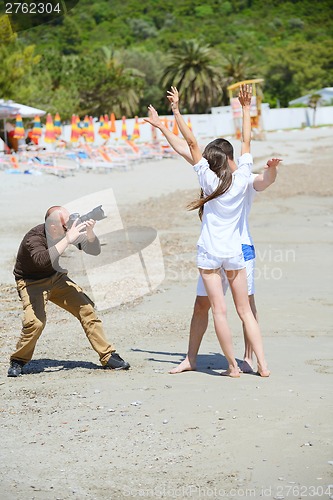 Image of photographer taking photo on beach