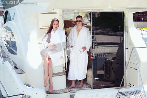 Image of young couple on yacht