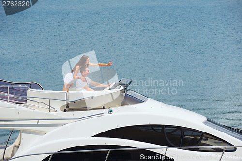 Image of young couple on yacht