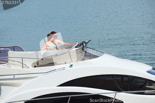 Image of young couple on yacht