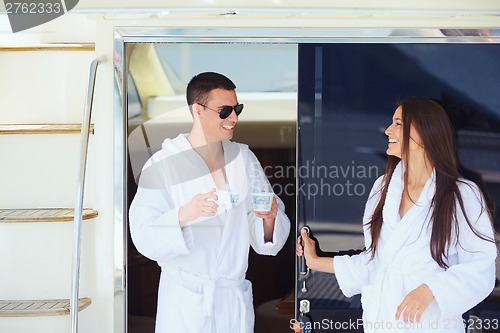 Image of young couple on yacht