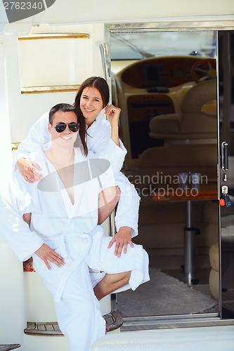 Image of young couple on yacht