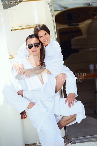 Image of young couple on yacht