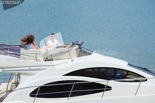 Image of young couple on yacht